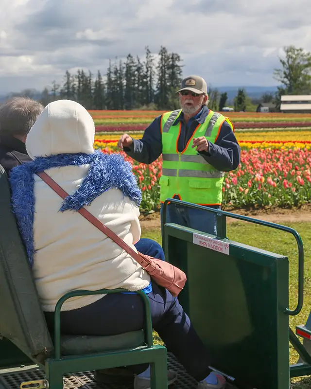 A photo from our Accessibility Field Tour shows a guide speaking to the seated guests.